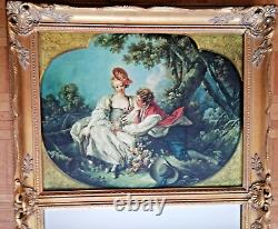 Carved wooden trumeau mirror adorned with an 18th century oil on canvas reproduction