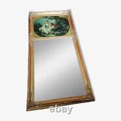 Carved wooden trumeau mirror adorned with an oil on canvas countryside landscape