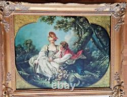 Carved wooden trumeau mirror adorned with an oil on canvas countryside landscape