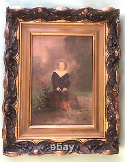 Framed wooden piece of a young boy without signature