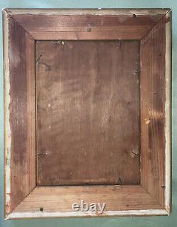 Framed wooden piece of a young boy without signature