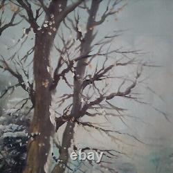 Oil on canvas signed Winter landscape under snowy river edge woods
