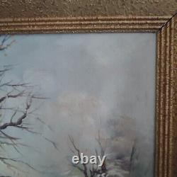 Oil on canvas signed Winter landscape under snowy river edge woods
