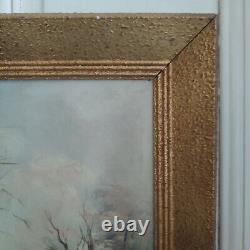Oil on canvas signed Winter landscape under snowy river edge woods