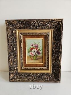 Oil on wood panel painting, bouquet of polychrome flowers, signed in a molded frame