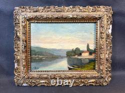 Old framed wooden oil painting on panel, signed, river scene