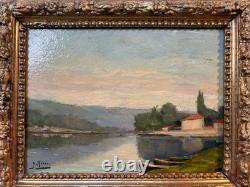 Old framed wooden oil painting on panel, signed, river scene
