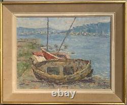 Old oil painting of a seascape with stranded boats impressionism signed Alvarez