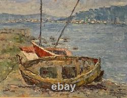 Old oil painting of a seascape with stranded boats impressionism signed Alvarez
