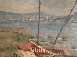 Old oil painting of a seascape with stranded boats impressionism signed Alvarez