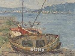 Old oil painting of a seascape with stranded boats impressionism signed Alvarez