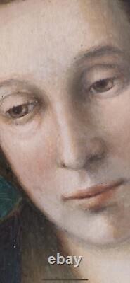 Old painting oil wood portrait of an elegant melancholic woman with blue drapery
