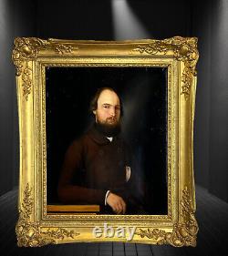 PAINTING / OIL ON WOOD FROM THE 19TH CENTURY PORTRAIT OF A WELL-FRAMED MAN