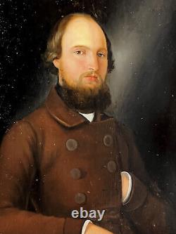 PAINTING / OIL ON WOOD FROM THE 19TH CENTURY PORTRAIT OF A WELL-FRAMED MAN