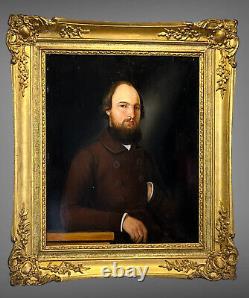 PAINTING / OIL ON WOOD FROM THE 19TH CENTURY PORTRAIT OF A WELL-FRAMED MAN