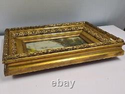 Painting on panel in a golden wooden frame