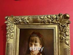 Portrait of a little girl signed and dated 1884, very beautiful gilded wooden frame