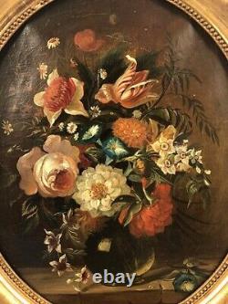 XIXth Century School, Bouquet of Flowers. Oil on canvas, oval wooden frame with gilded stucco.