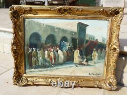 Huile sur panneau Orientale signée Vincent Manago Scène d'un souk au Maghreb