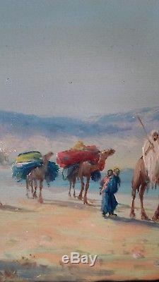 Huile sur panneau signée V MANAGO caravane dans le désert