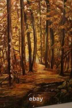 Tableau huile sur toile monogrammée Sous-bois au ruisseau en automne