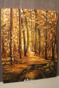 Tableau huile sur toile monogrammée Sous-bois au ruisseau en automne